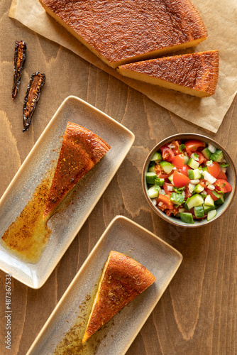 Traditional chickpea flour dish bread with fresh vegetable salad. Moroccan cuisine. photo