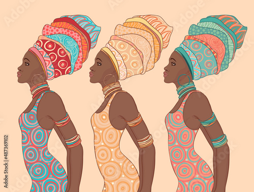 Pretty African American woman in traditional turban. Profile view