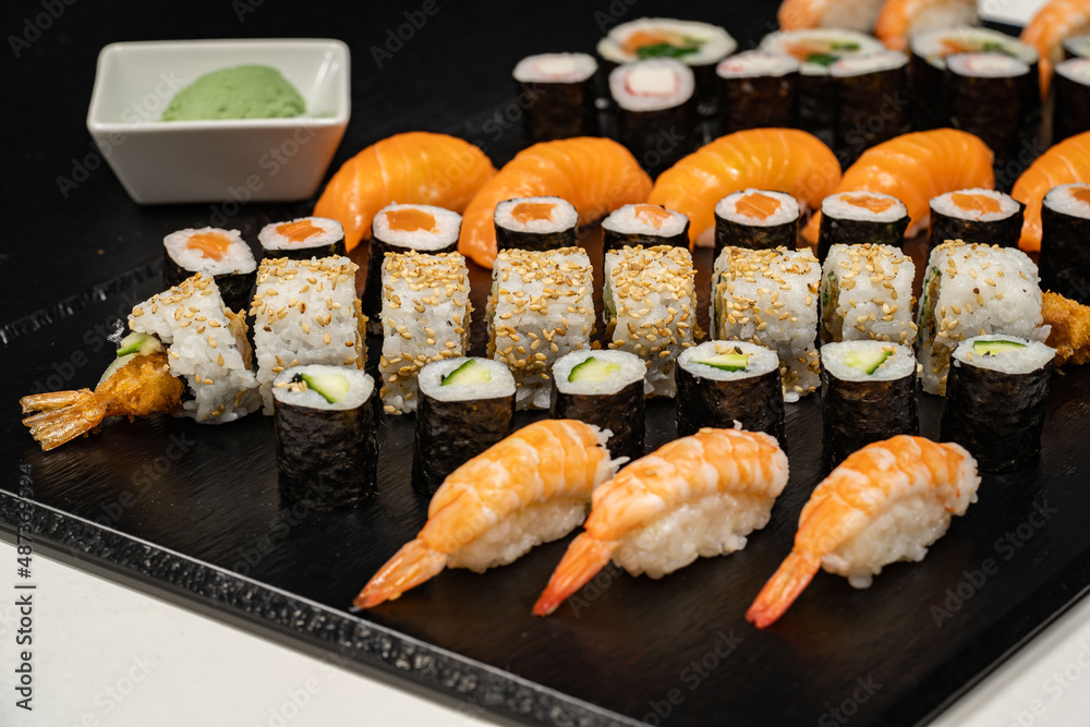 Assorted sushi nigiri and maki big set on slate. A variety of Japanese sushi with tuna, crab, salmon, eel and rolls. Top view
Assorted sushi nigiri and maki big set on slate. A variety of Japanese sushi with tuna, crab, salmon, eel and rolls. Top view