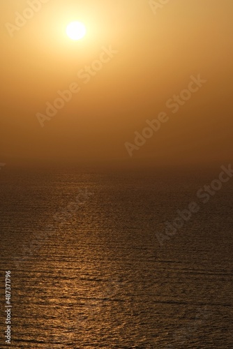 Amazing orange sunset and view of the Aegean Sea in Santorini Greece
