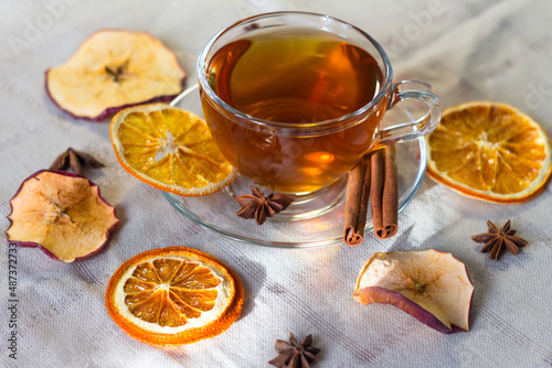 Cup of tea and slices of dried orange