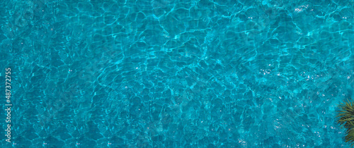 Swimming pool blue water in summer top view angle. Aerial view images of swimming pool in a sunny day which suitable for sport or relax on vacation time or workout for burn some calories in holiday.