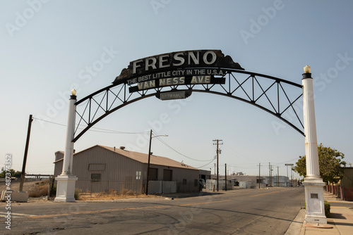 Fresno, California, USA - July 15, 2021: Late afternoon light illuminates a historic downtown Fresno sign. photo