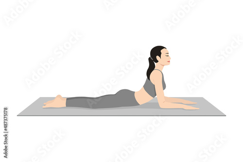 Sphinx Pose. Beautiful girl practice Salamba Bhujangasana, Niravalasana. Young attractive woman practicing yoga exercise. working out, black wearing sportswear, grey pants and top, indoor full length