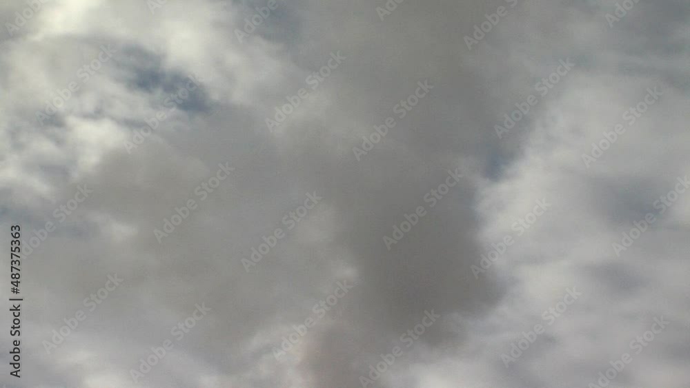 dirty smoke coming out of chimney, tilt up, cloudy sky, environmental pollution dirty smoke coming out of chimney, tilt up, cloudy sky, environmental pollution