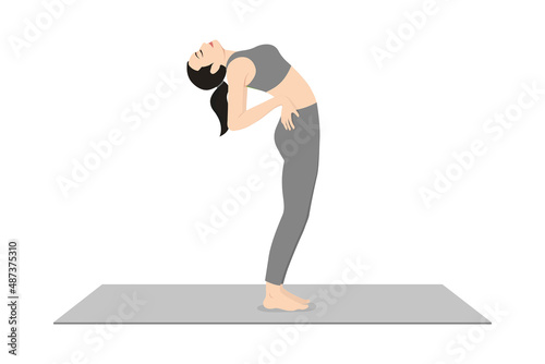 Standing Backbend. Beautiful girl practice Anuvittasana. Young attractive woman practicing yoga exercise. working out, black wearing sportswear, grey pants and top, indoor full length, relax calmness