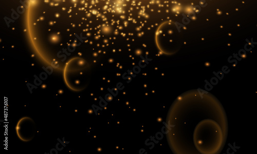 Gold bokeh, shiny glittering golden and silver stars. Glitter gold de-focused lights on black background. Background of bright glow bokeh. 
