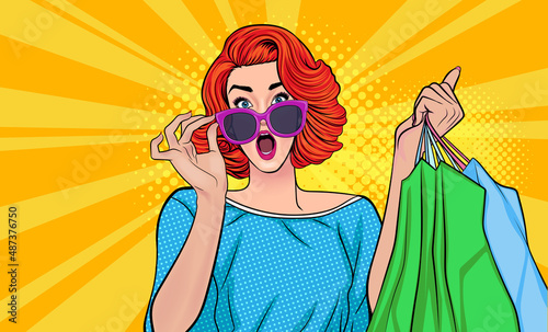 surprised woman hand touch glasses and carring shopping bags