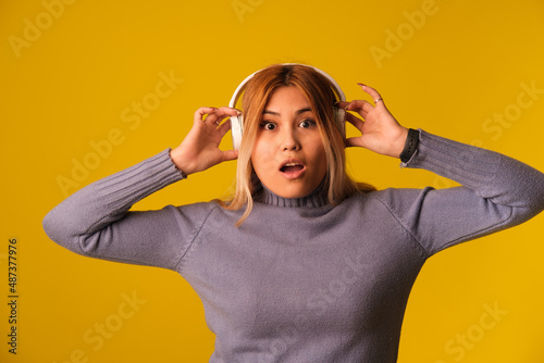 Asian-looking woman in headphones