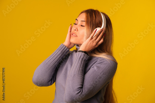 Asian-looking woman in headphones