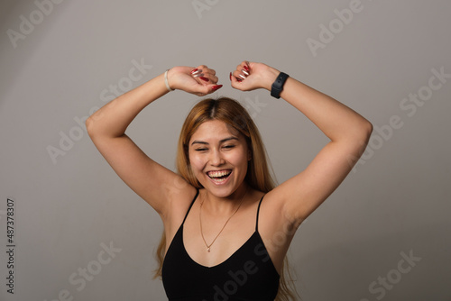 Asian woman dancing, rejoicing