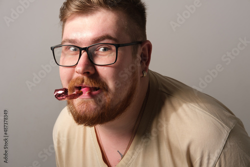 A man blows a pipe, a holiday