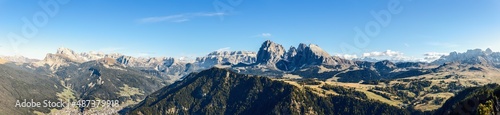 Super panorama of Langkofel Group mountains and valleys below. Seiser Alm, South Tyrol, Italy.
