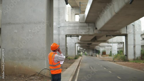 Wallpaper Mural worker with the viaducts on the background. Transportation in Bangkok, Thailand. Torontodigital.ca