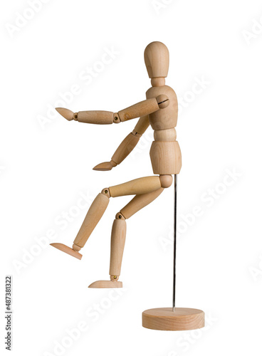wooden mannequin with bent arms and legs on stand isolated on white background