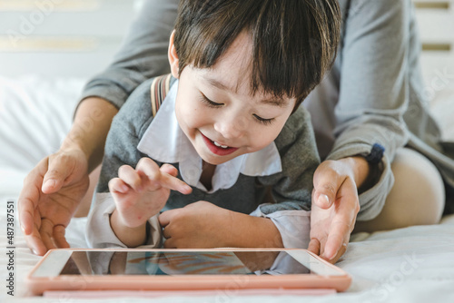 child playing with tablet