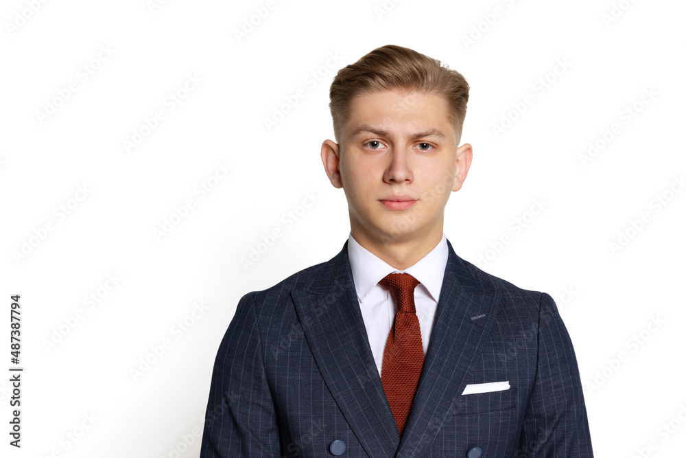 Half-length portrait of handsome young businessman, student, diplomat looking at camera isolated on white studio background. Human emotions, facial expression concept. Half-length portrait of handsome young businessman, student, diplomat looking at camera isolated on white studio background. Human emotions, facial expression concept.