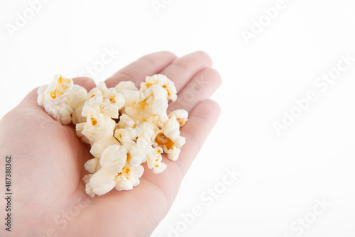 image of pop corn hand white background