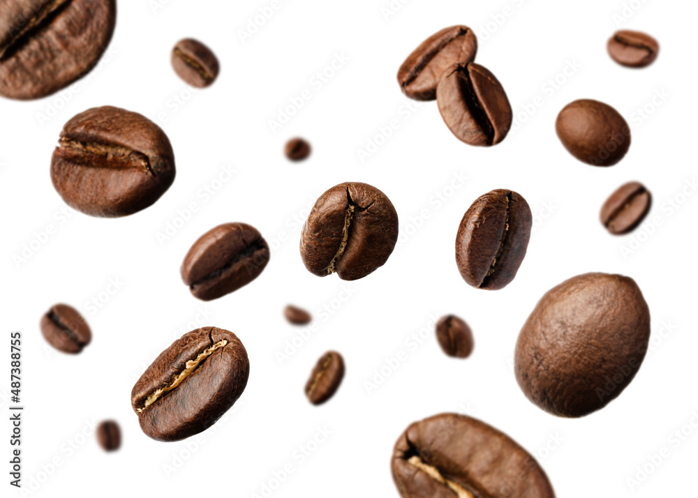 Many roasted coffee beans flying on white background Many roasted coffee beans flying on white background