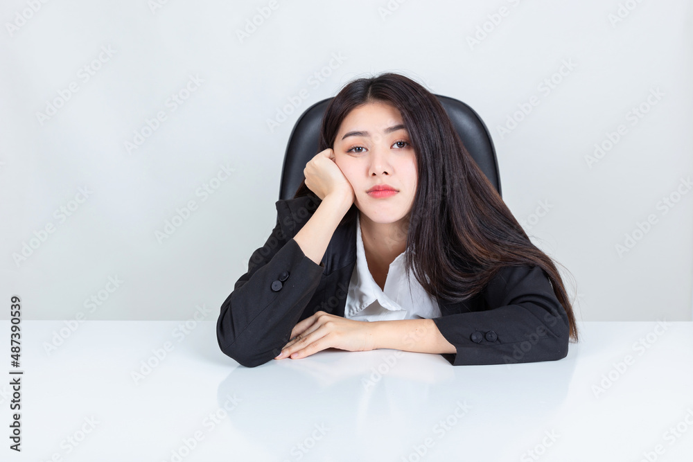 Bored work, office syndrome, Asian business woman sit at desk in office. Bored work, office syndrome, Asian business woman sit at desk in office.