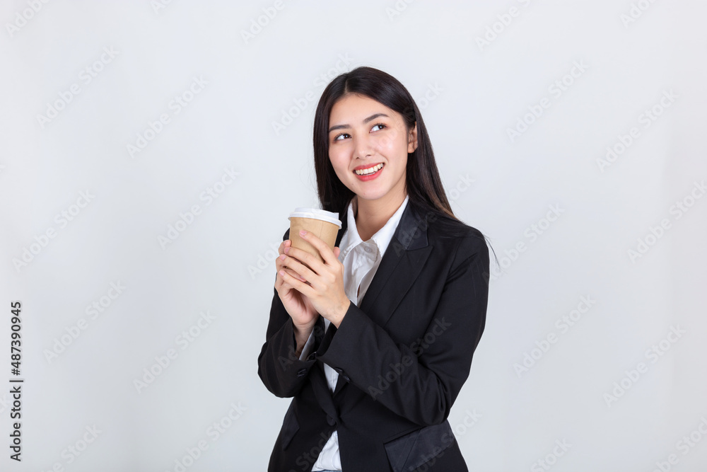 Entrepreneur pretty young asian woman ,Beautiful attractive asian business woman wearing black suit smile feeling happy holding coffee cup with copy space for your promotional or text. Entrepreneur pretty young asian woman ,Beautiful attractive asian business woman wearing black suit smile feeling happy holding coffee cup with copy space for your promotional or text.
