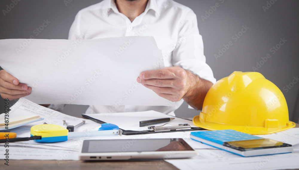 Architect working in construction plan. Working in office Architect working in construction plan. Working in office