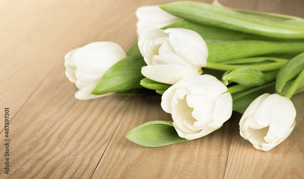 bouquet of white tulips on a wooden table bouquet of white tulips on a wooden table