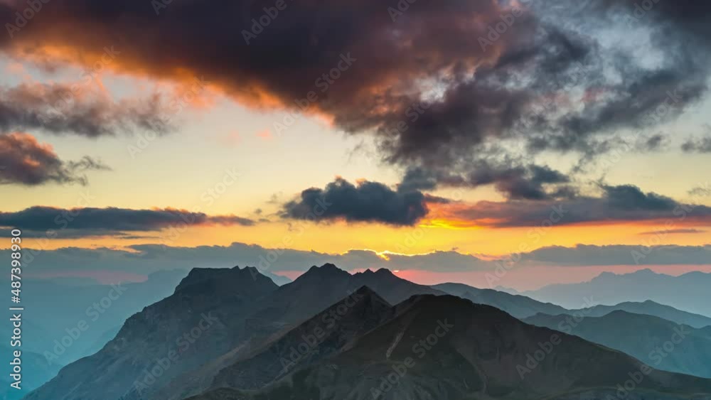 Colorful and Epic Cloudy Sunset Over French Alps Mountains Peaks in the Shadow of Sun Colorful and Epic Cloudy Sunset Over French Alps Mountains Peaks in the Shadow of Sun