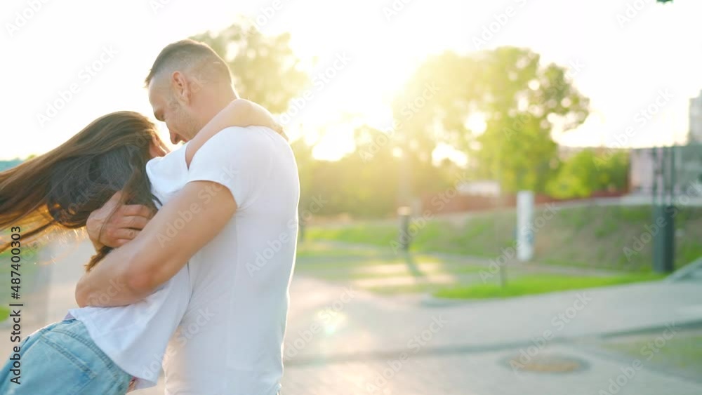 Daughter runs to dad and hugs him. Father picks up the child in his arms. Daughter runs to dad and hugs him. Father picks up the child in his arms.