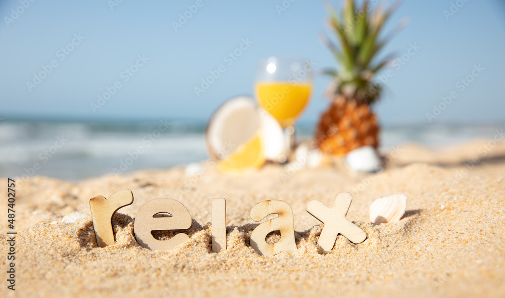 juice fruit cocktail on a beach- relax and vacation concept