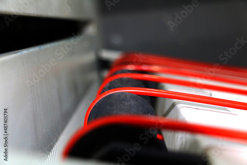 CTP is an imaging technology used in printing processes. An image created in a Desktop Publishing application is output directly to a printing plate. CTP machine red conveyor belts and stop sensors