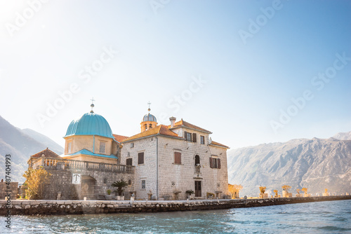 St. George Island near town Perast in Kotor bay, Montenegro. Scenic panorama view of the historic town of Perast at famous Bay of Kotor.
