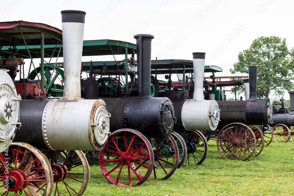 Black and White Old Time Antique Steam Engines Lined Up in a Row