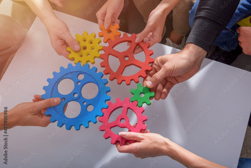 Business team connect pieces of gears like a teamwork and partners Business team connect pieces of gears like a teamwork and partners