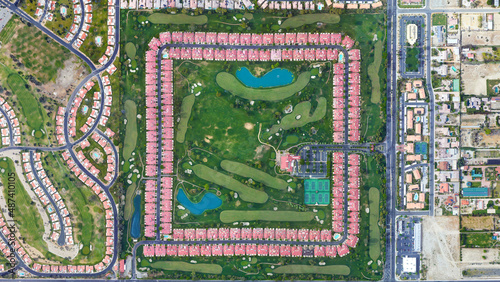 Square settlement and green area looking down aerial view from above     Bird   s eye view Palm Desert  California  USA