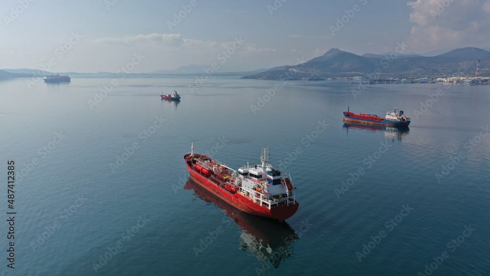 Aerial drone photo of crude oil and petrochemical or lpg tankers anchored in industrial Gulf of Elefsina, Attica, Greece