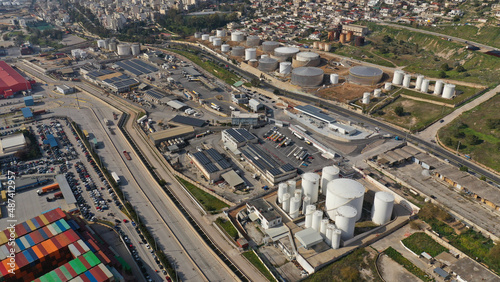 Aerial drone photo of huge crude oil tanks near oil refinery plant