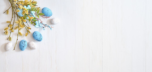 Willow branches and decorations, easter eggs on a light background. Happy easter flat lay concept