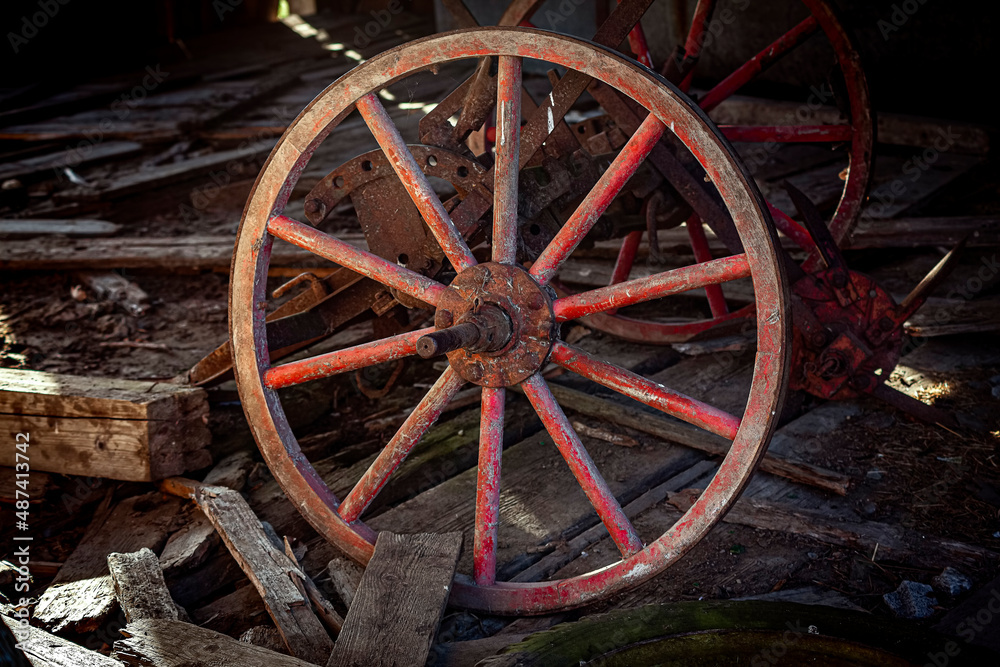 ancient red wooden wheel with spokes
