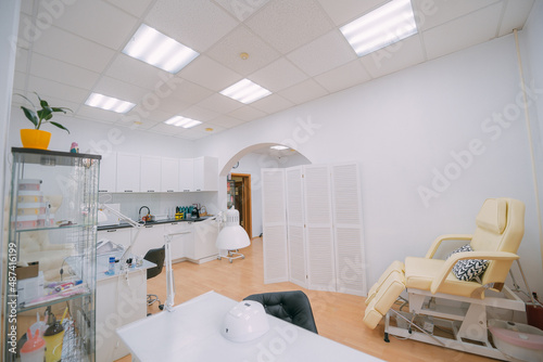 The interior of the nail salon without people. A bright  modern salon for the care of nails