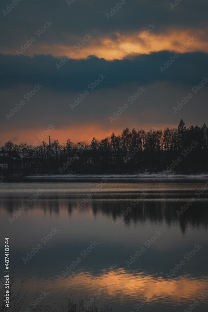 sunset over the lake in winter