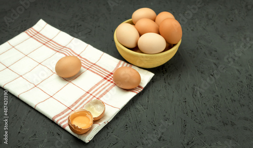 Fresh chicken eggs in a bowl, close-up