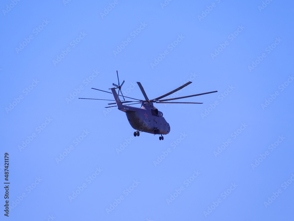 Fototapeta premium Russia, St. Petersburg - June 24, 2020: Russian transport helicopter Mil Mi-26 RF-06805 of the Russian Air Force in flight at Parade of Victory in World War II...