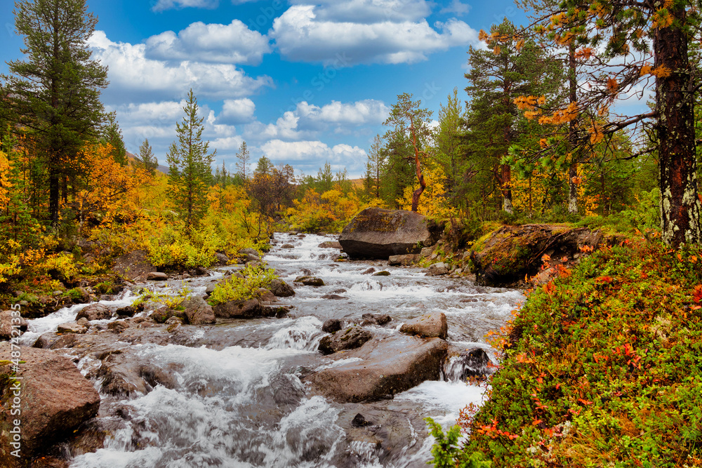 River in the Khibiny mountains in autumn. Autumn landscape River in the Khibiny mountains in autumn. Autumn landscape