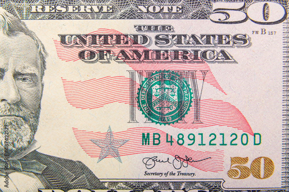 Fototapeta premium Fragments close-up a fragment of a fifty dollar bill.