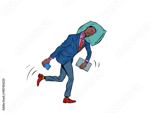 A tired African businessman sleeps on the move. Goes to work in the morning with his head on a pillow