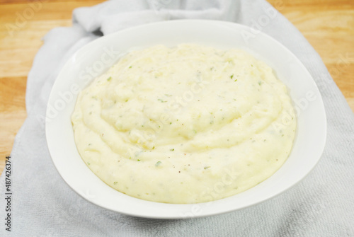 A Bowl of Creamy Buttery Mashed Potatoes with Herbs