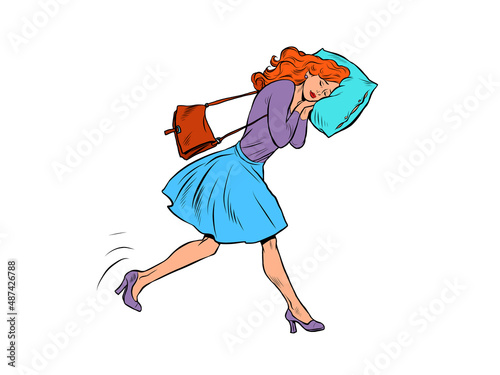 A tired businesswoman sleeps on the move. Goes to work in the morning with his head on a pillow