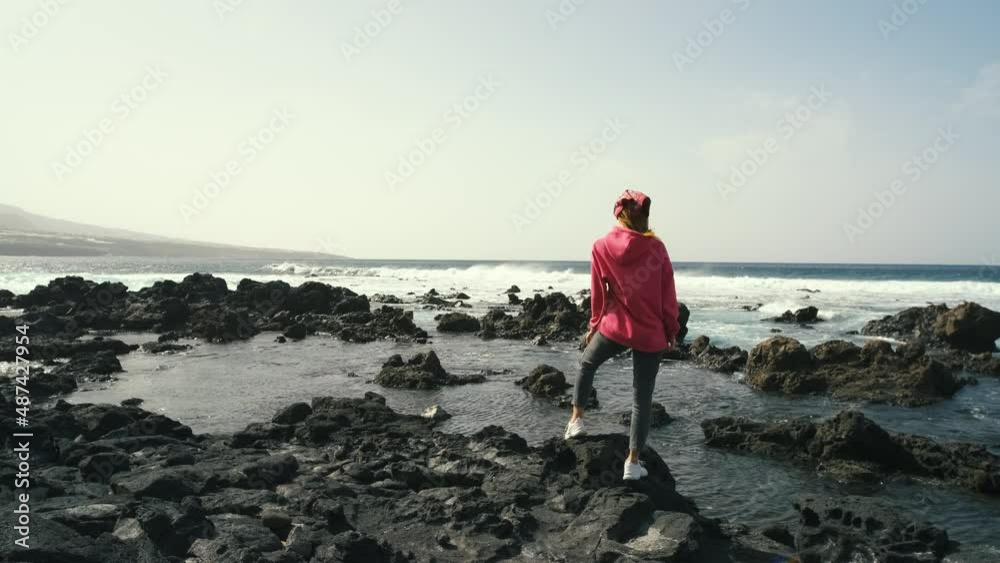 woman enjoying the ocean on volcanic beach of the Canary island of Tenerife. Beautiful landscapes in the north of Tenerife island
woman enjoying the ocean on volcanic beach of the Canary island of Tenerife. Beautiful landscapes in the north of Tenerife island