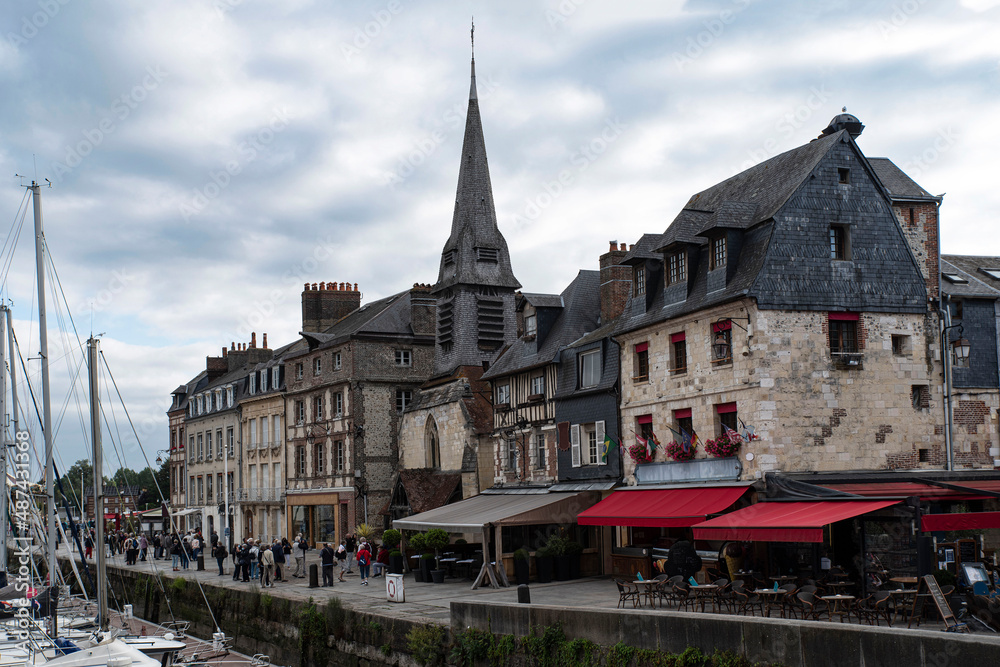 City of Honfleur in Normandy with its typical houses and boat lock in the quay